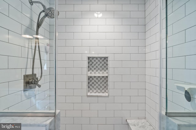 bathroom with tiled shower