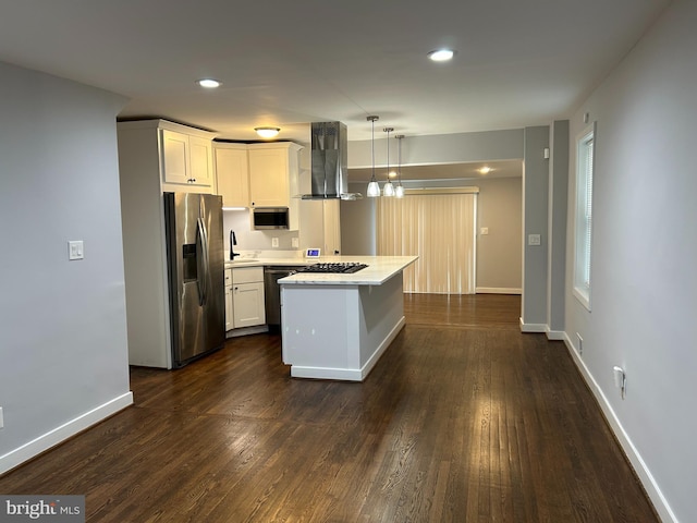 kitchen featuring light countertops, white cabinets, island range hood, and stainless steel appliances