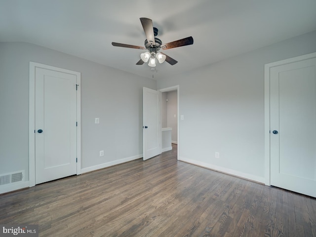 unfurnished bedroom featuring visible vents, a ceiling fan, baseboards, and wood finished floors