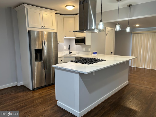 kitchen with a peninsula, island range hood, dark wood-type flooring, a sink, and stainless steel appliances