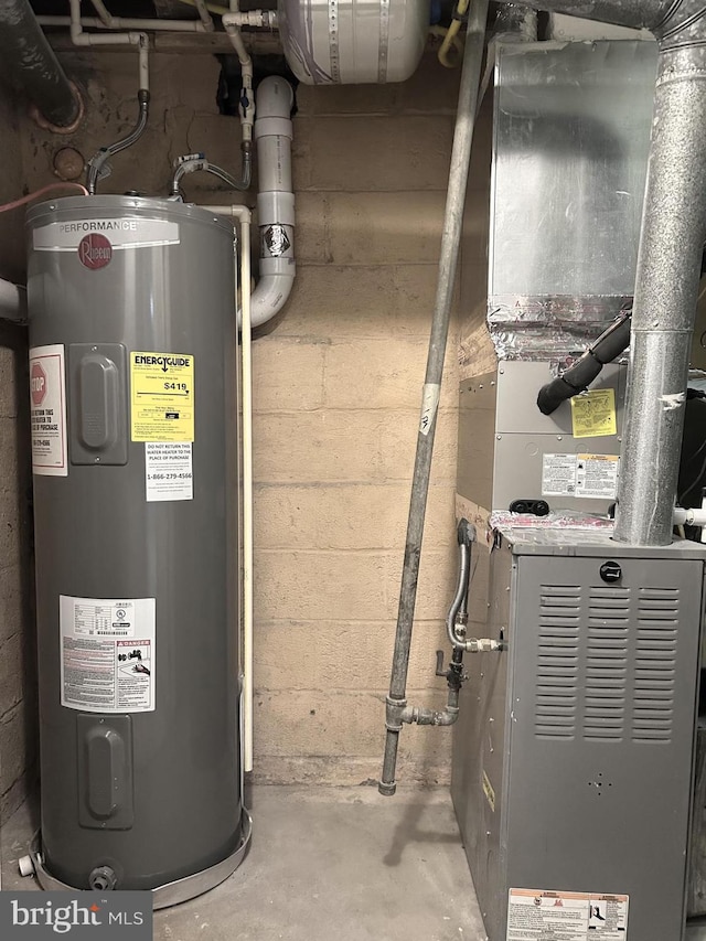 utility room with heating unit and water heater