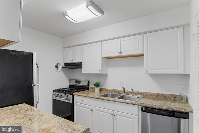 kitchen featuring a sink, appliances with stainless steel finishes, white cabinets, and under cabinet range hood