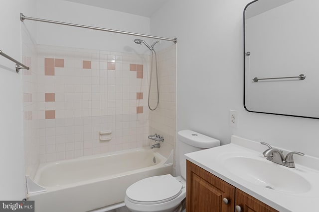 bathroom with shower / bathtub combination, vanity, and toilet