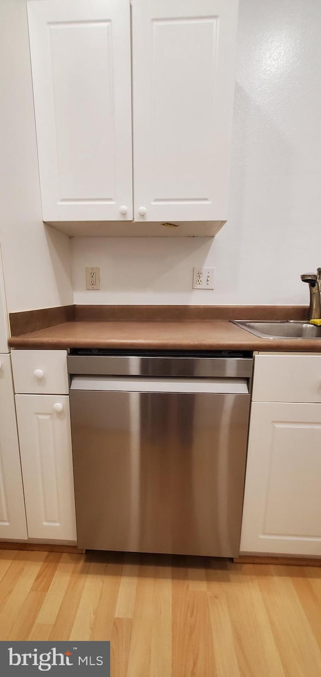 11800 Old Georgetown Unit 1103, Rockville, MD 20852 - detailed view of stainless steel dishwasher, white cabinets, and light wood finished floors