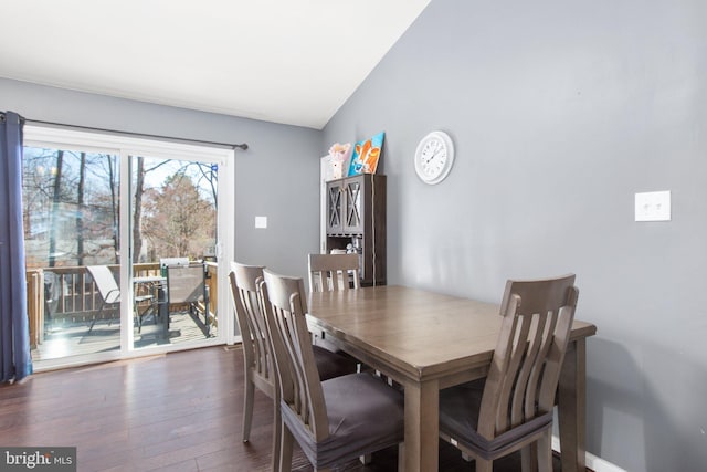 dining space with wood finished floors