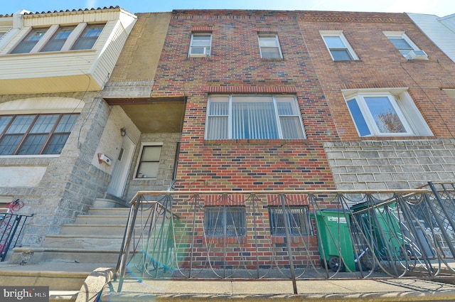 exterior space with brick siding