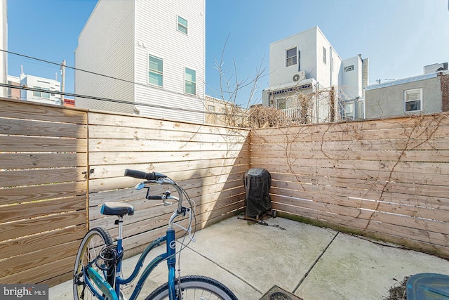view of patio / terrace featuring fence