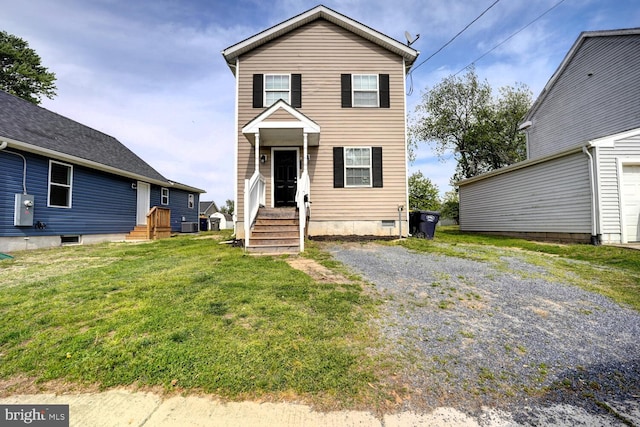 traditional-style house featuring a front lawn, cooling unit, and crawl space