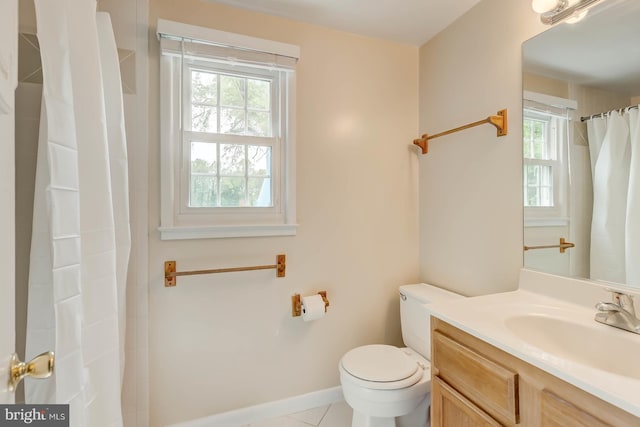 full bath with tile patterned floors, toilet, vanity, and plenty of natural light