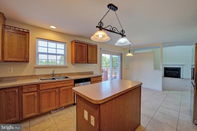 170 Otter Way, Frederica, DE 19946 - kitchen with brown cabinets, light tile patterned floors, a center island, hanging light fixtures, and recessed lighting