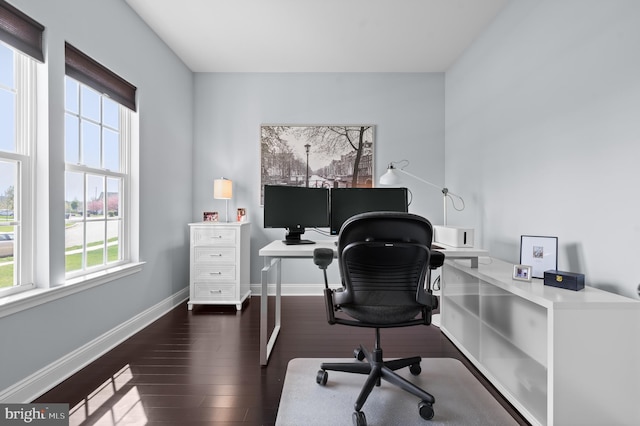 home office with baseboards, wood finished floors, and a wealth of natural light