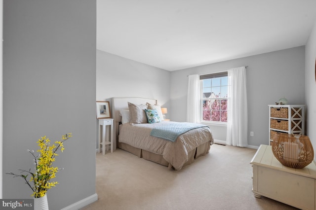 carpeted bedroom with baseboards