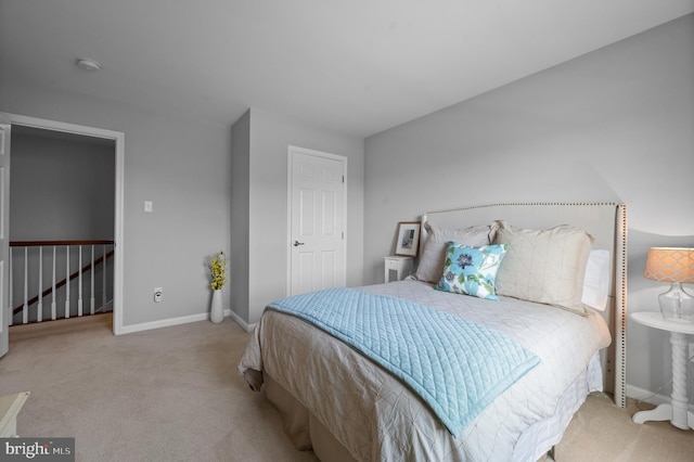 bedroom with carpet floors and baseboards
