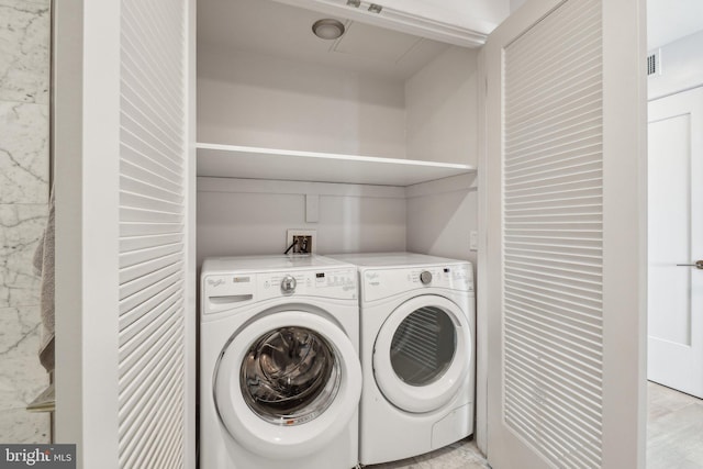 laundry area with laundry area and independent washer and dryer