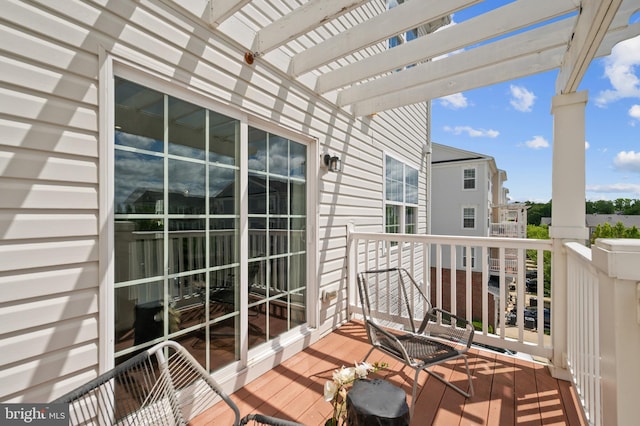 balcony featuring a pergola