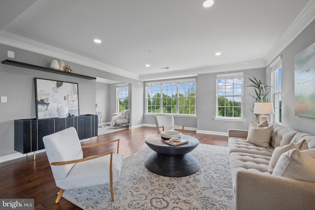 living room featuring ornamental molding, wood finished floors, baseboards, and recessed lighting