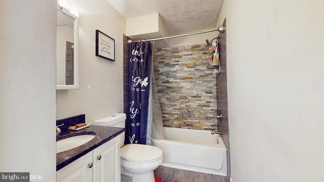 5909 K St, Fairmount Heights, MD 20743 - bathroom with a textured ceiling, toilet, shower / tub combo, wood finished floors, and vanity