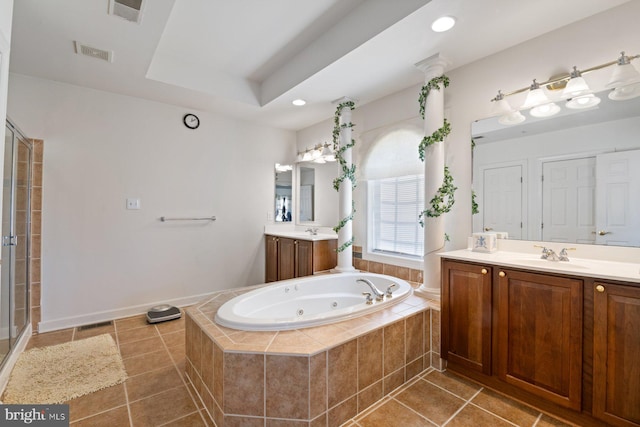bathroom featuring a shower stall, a tub with jets, a sink, tile patterned flooring, and visible vents