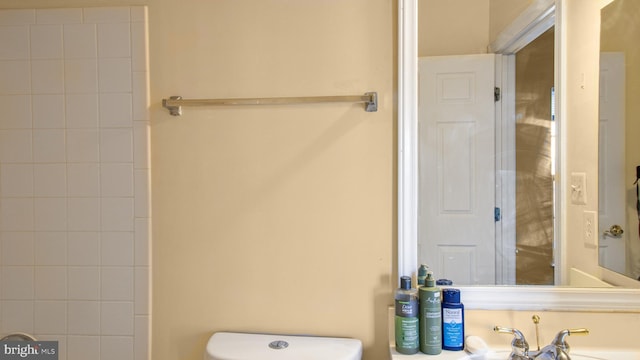 bathroom with toilet and a sink