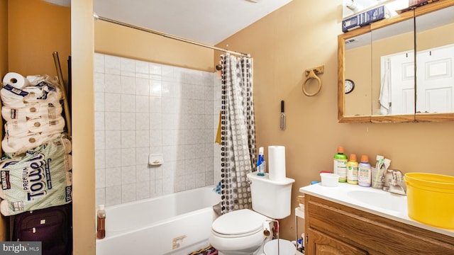 bathroom with toilet, vanity, and shower / bathtub combination with curtain