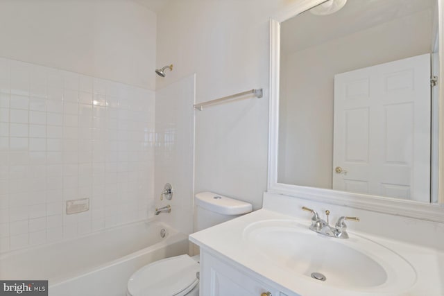bathroom with shower / bathing tub combination, toilet, and vanity