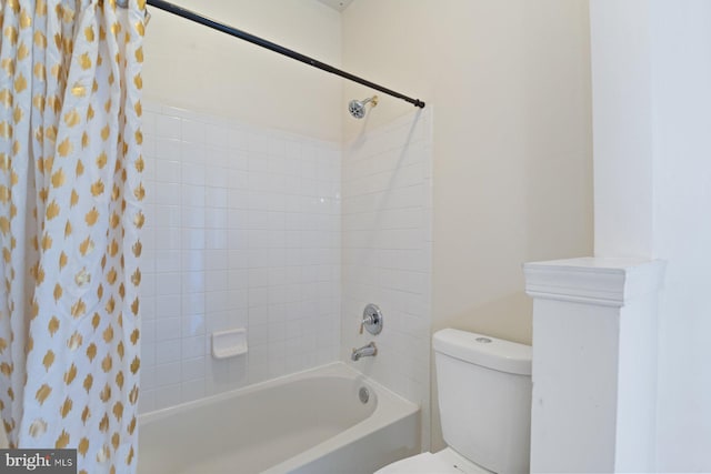 full bath featuring shower / bath combo and toilet