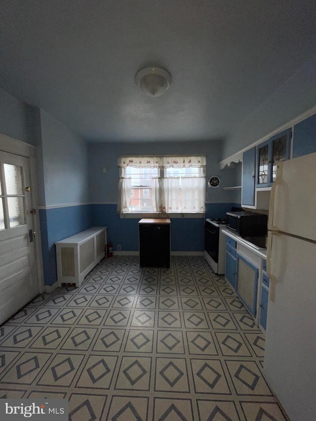 3418 Englewood St, Philadelphia, PA 19149 - kitchen featuring light countertops, baseboards, and white appliances