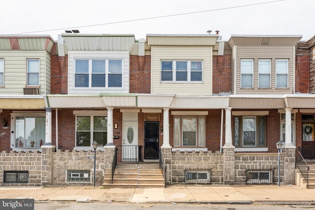 2954 Cedar St, Philadelphia, PA 19134 - view of property featuring brick siding and covered porch