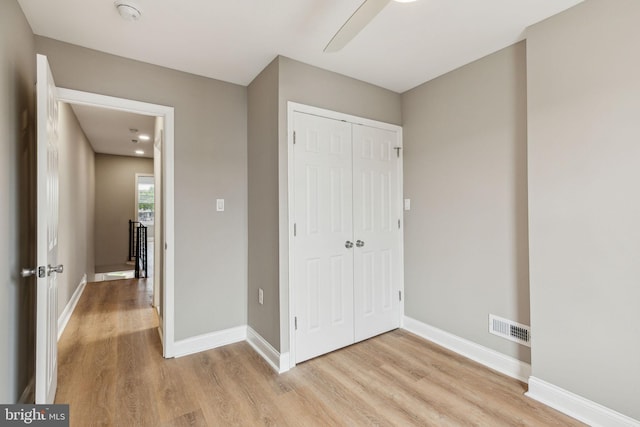 2954 Cedar St, Philadelphia, PA 19134 - unfurnished bedroom with visible vents, a ceiling fan, light wood-style floors, a closet, and baseboards