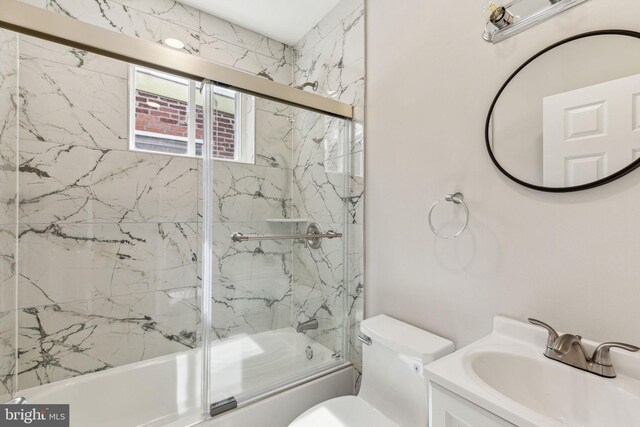 2954 Cedar St, Philadelphia, PA 19134 - full bathroom featuring combined bath / shower with glass door, toilet, and vanity