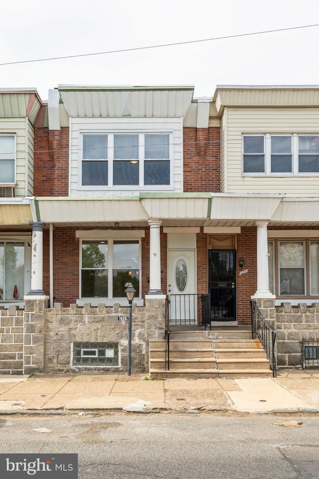 2954 Cedar St, Philadelphia, PA 19134 - townhome / multi-family property with brick siding and covered porch
