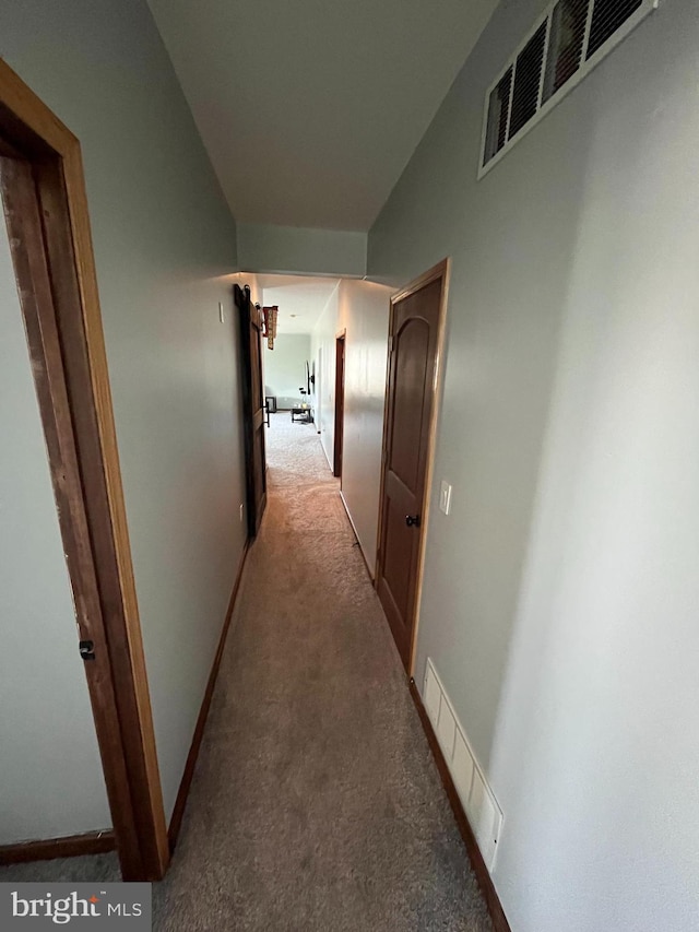 corridor with visible vents and light carpet