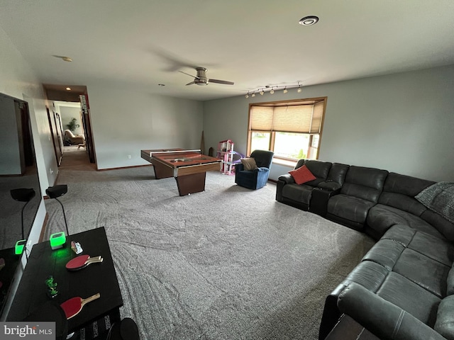 carpeted living area featuring a ceiling fan