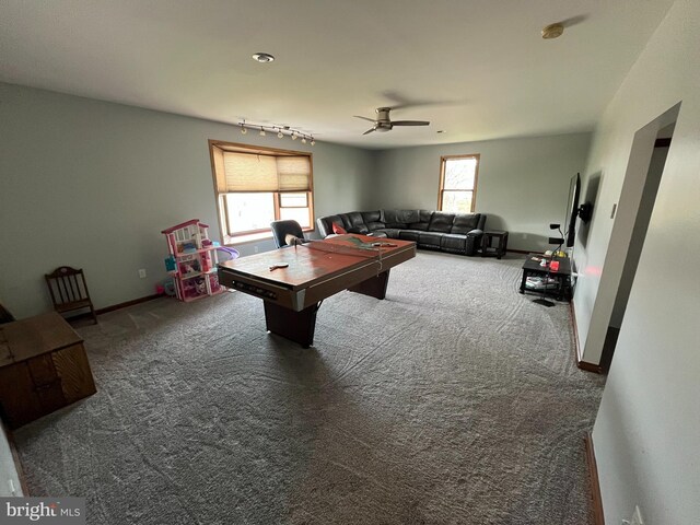 rec room featuring baseboards, a ceiling fan, carpet flooring, and a healthy amount of sunlight