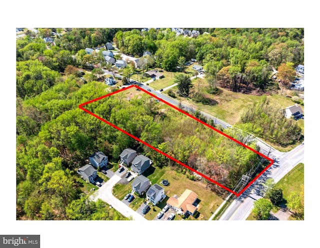 birds eye view of property with a residential view