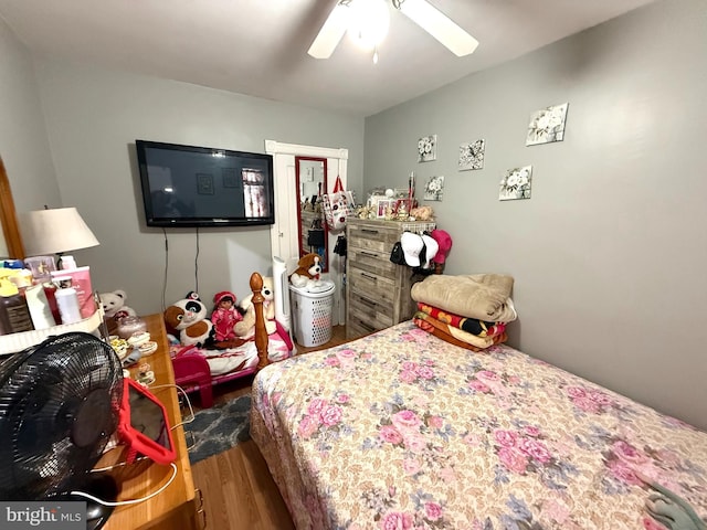 bedroom featuring wood finished floors and ceiling fan