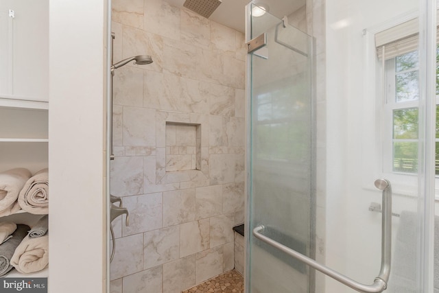 bathroom with a shower stall