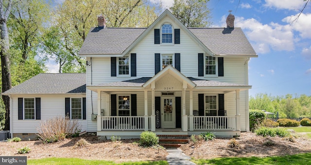 traditional home with roof with shingles, a chimney, central AC unit, crawl space, and a porch