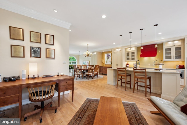 interior space featuring light wood finished floors, recessed lighting, a chandelier, and crown molding