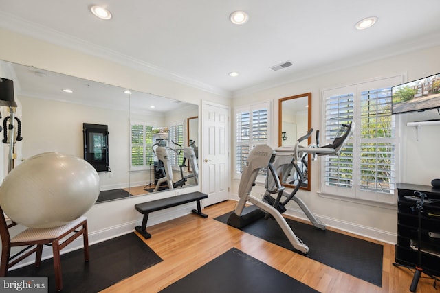 workout area featuring recessed lighting, wood finished floors, visible vents, and baseboards