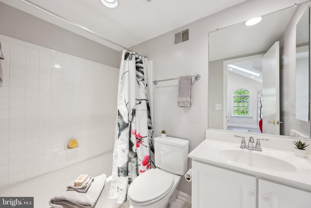 full bathroom featuring toilet, vanity, and visible vents
