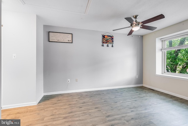 7329 Split Rail Ln, Laurel, MD 20707 - unfurnished room with attic access, a ceiling fan, wood finished floors, and baseboards