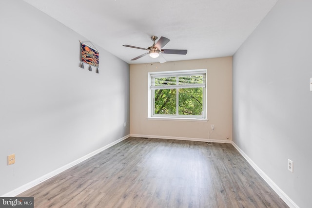 7329 Split Rail Ln, Laurel, MD 20707 - spare room with wood finished floors, a ceiling fan, and baseboards