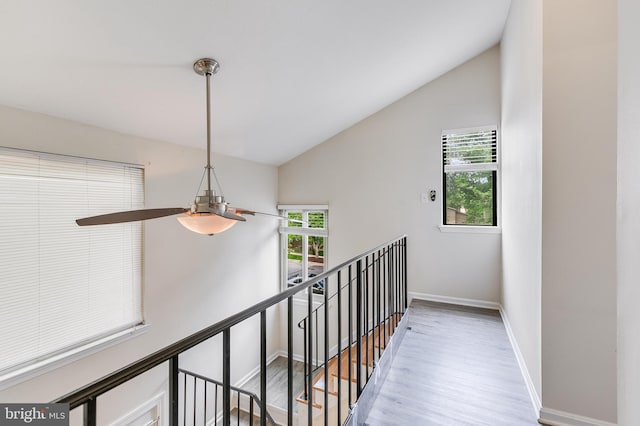 7329 Split Rail Ln, Laurel, MD 20707 - hallway with lofted ceiling, an upstairs landing, wood finished floors, and baseboards