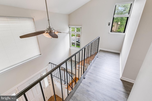 7329 Split Rail Ln, Laurel, MD 20707 - staircase featuring wood finished floors, healthy amount of natural light, a ceiling fan, vaulted ceiling, and baseboards