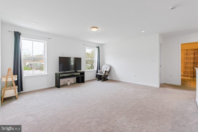 carpeted living room with baseboards and recessed lighting