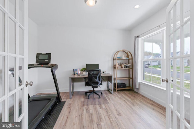 home office with baseboards, recessed lighting, french doors, and light wood finished floors