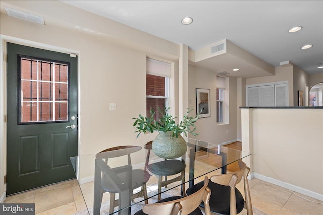 dining space with light tile patterned floors, baseboards, visible vents, and recessed lighting