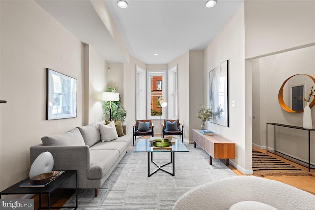 living area with recessed lighting and baseboards