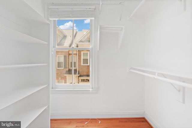 spacious closet with wood finished floors